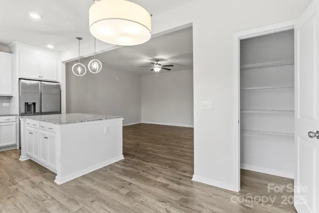 a view of a kitchen with cabinets