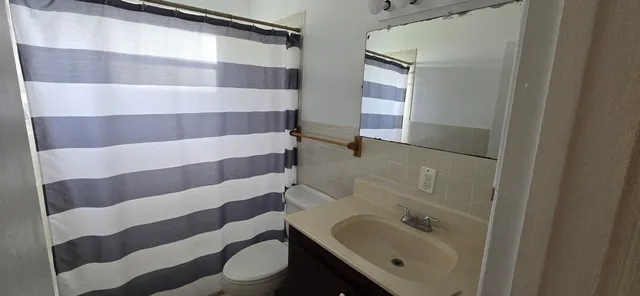 a bathroom with a sink and mirror