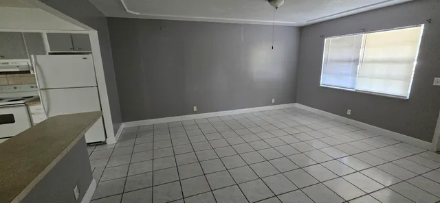 a view of an empty room and window