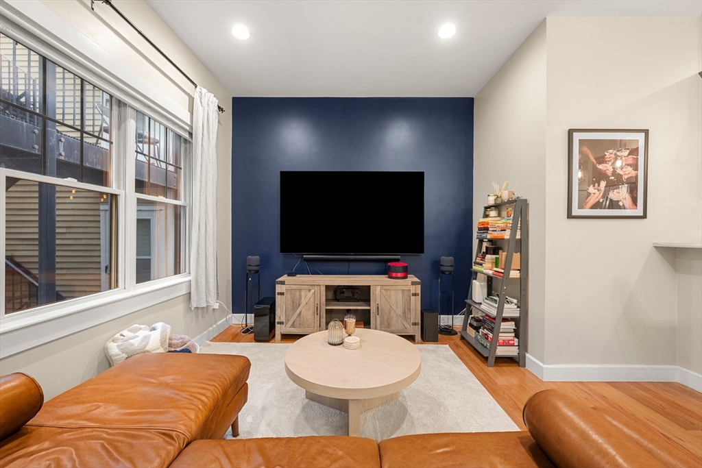 345 West Broadway, Unit 4 Boston, MA 02127 - Photo 5 of 26 a living room with furniture and a flat screen tv
