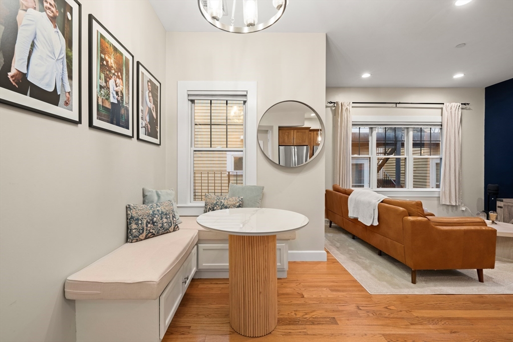 345 West Broadway, Unit 4 Boston, MA 02127 - Photo 10 of 26 a living room with furniture and a large window