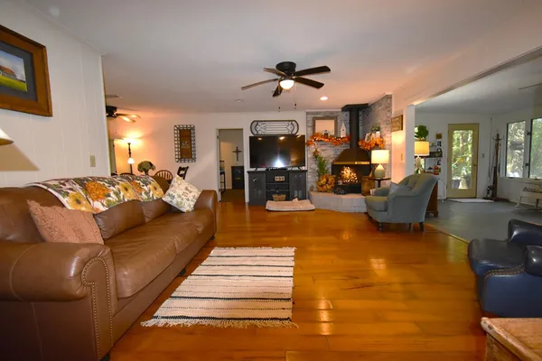 a living room with furniture and a flat screen tv