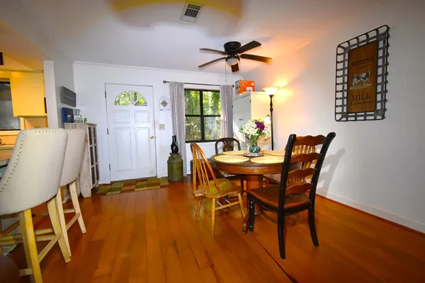 a view of a dining room with furniture and window