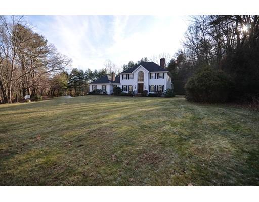 122 Armsby Road Sutton, MA 01590 - Photo 1 of 30 a view of a big house with a big yard and large trees
