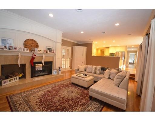 122 Armsby Road Sutton, MA 01590 - Photo 11 of 30 a living room with furniture a fireplace and a flat screen tv