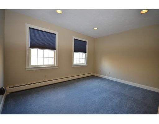 122 Armsby Road Sutton, MA 01590 - Photo 20 of 30 a view of an empty room with wooden floor and windows