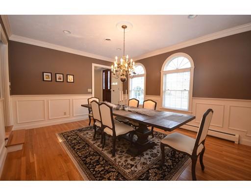 122 Armsby Road Sutton, MA 01590 - Photo 4 of 30 a view of a dining room with furniture and a chandelier