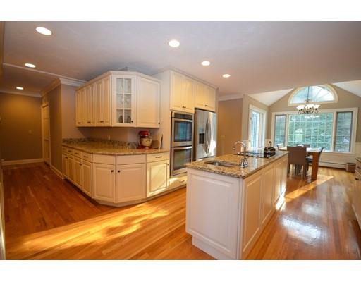 122 Armsby Road Sutton, MA 01590 - Photo 6 of 30 a kitchen with stainless steel appliances granite countertop a stove and a refrigerator