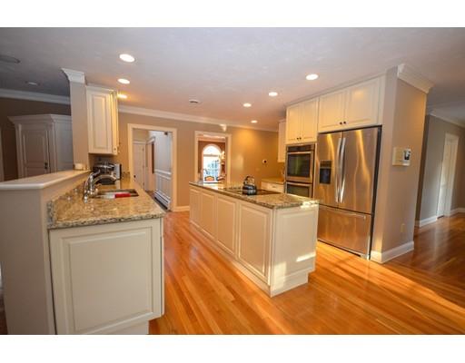 122 Armsby Road Sutton, MA 01590 - Photo 7 of 30 a kitchen with stainless steel appliances granite countertop a refrigerator a sink and a stove