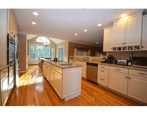 122 Armsby Road Sutton, MA 01590 - Photo 8 of 30 a kitchen with stainless steel appliances granite countertop a stove a sink dishwasher and a refrigerator with wooden floor