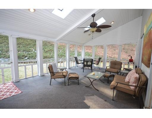 122 Armsby Road Sutton, MA 01590 - Photo 10 of 30 a living room with furniture a chandelier fan and a large window