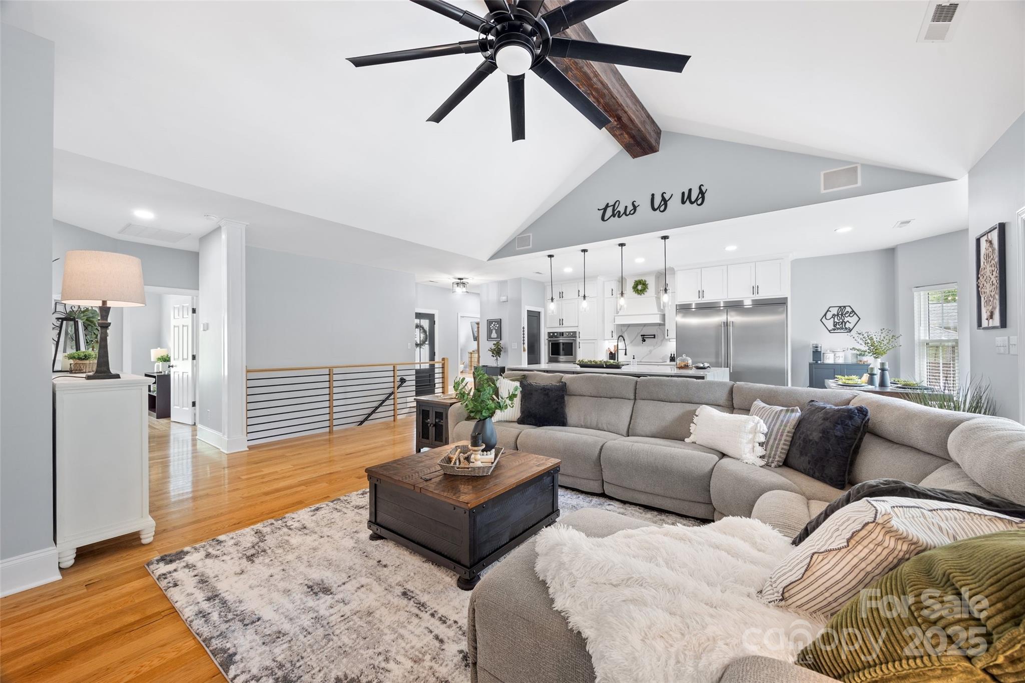 184 Quiet Cove Road Mooresville, NC 28117 - Photo 11 of 45 a living room with furniture and a wooden floor