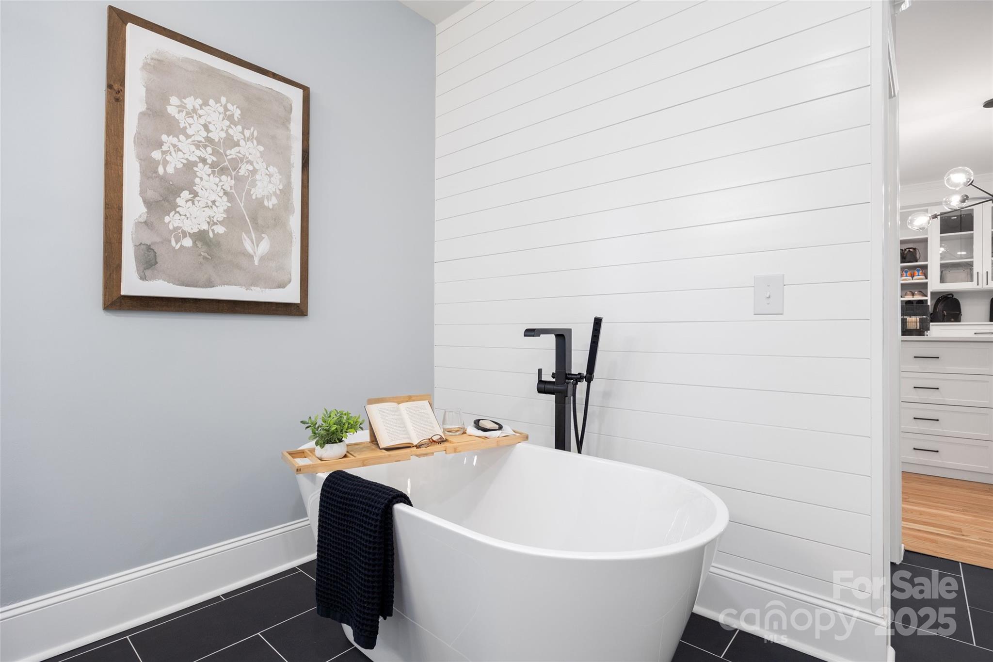 184 Quiet Cove Road Mooresville, NC 28117 - Photo 16 of 45 a white bath tub sitting next to a white wall