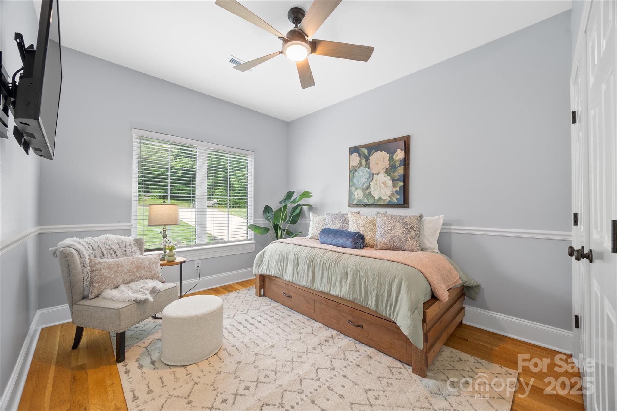 184 Quiet Cove Road Mooresville, NC 28117 - Photo 20 of 45 a spacious bedroom with a bed and a couch