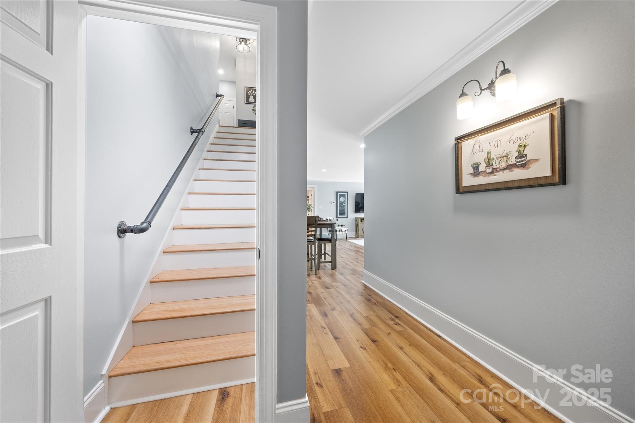 184 Quiet Cove Road Mooresville, NC 28117 - Photo 23 of 45 a view of a hallway with wooden floor and entryway