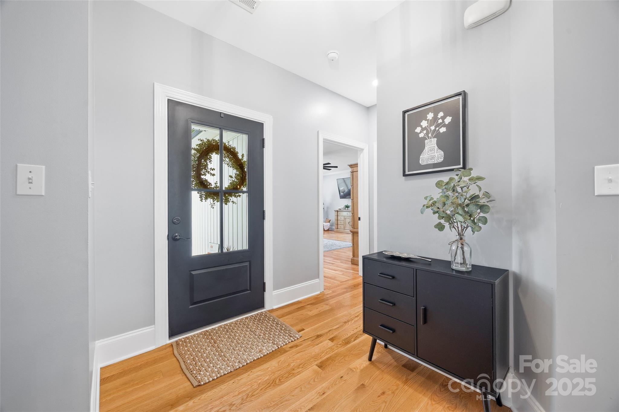 184 Quiet Cove Road Mooresville, NC 28117 - Photo 4 of 45 a living room with furniture and wooden floor