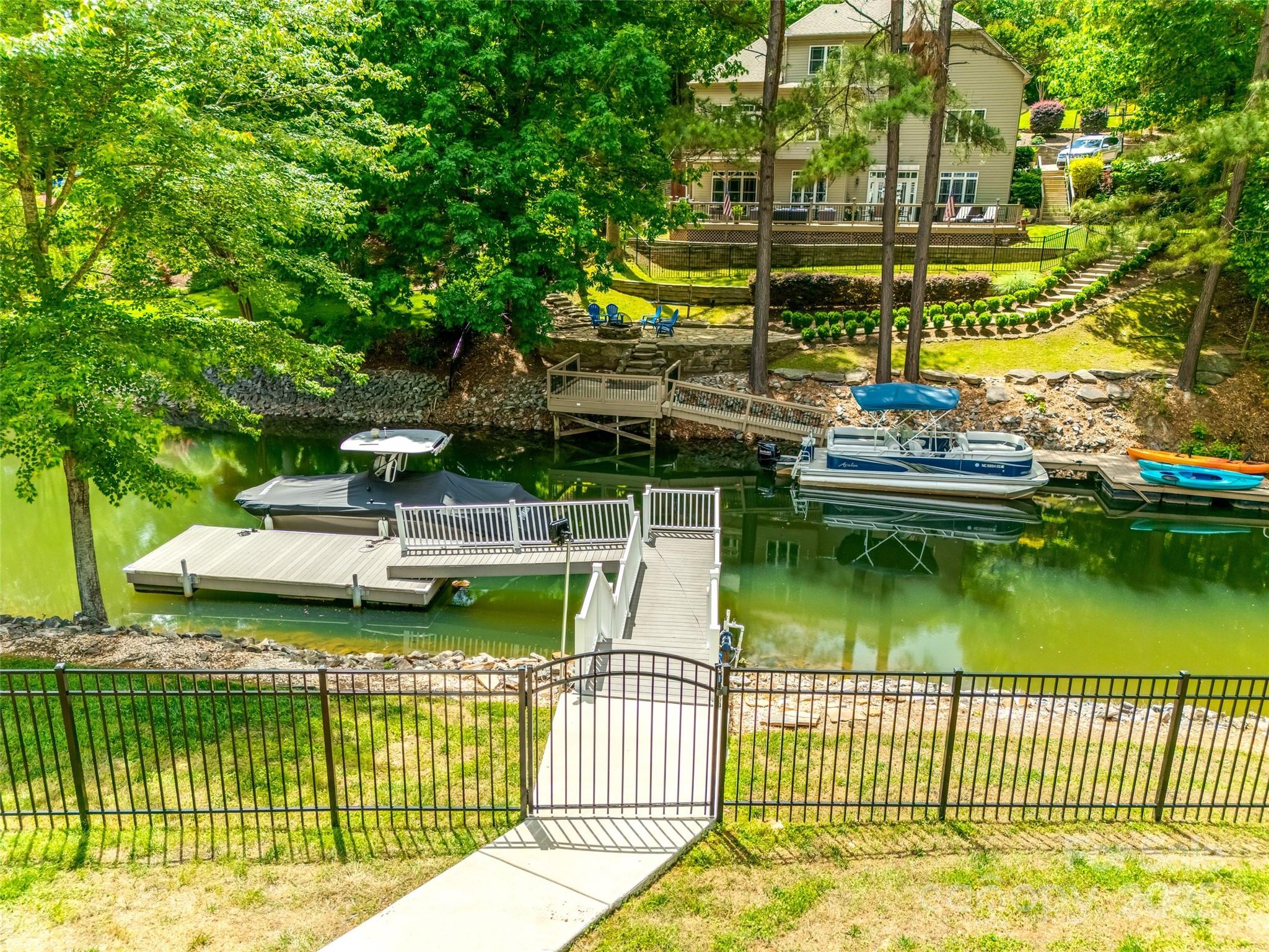 184 Quiet Cove Road Mooresville, NC 28117 - Photo 43 of 45 a view of a lake with a house