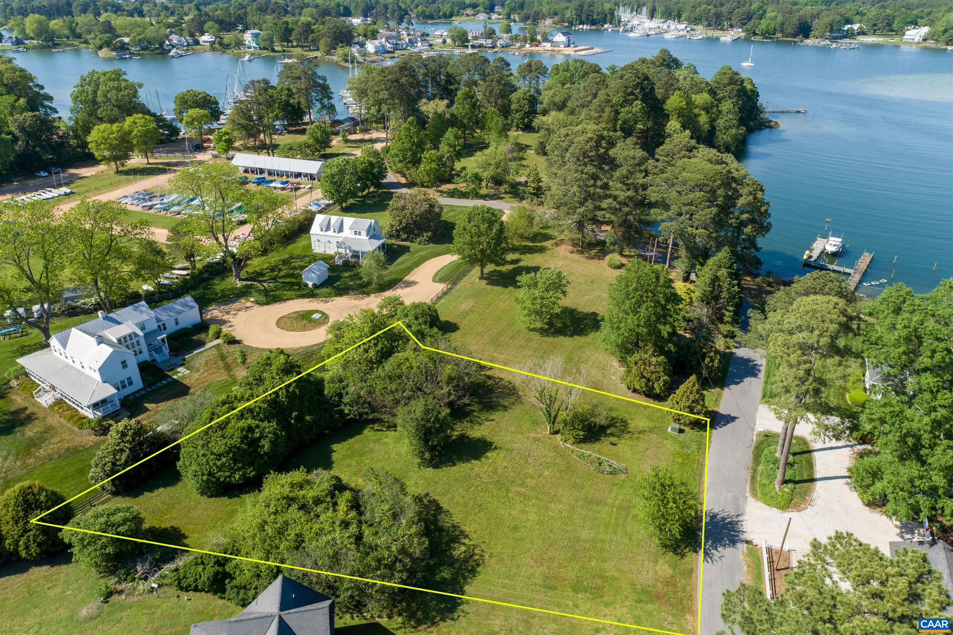 0 Fishing Bay Road Deltaville, VA 23043 - Photo 2 of 13 an aerial view of a residential houses with outdoor space and trees