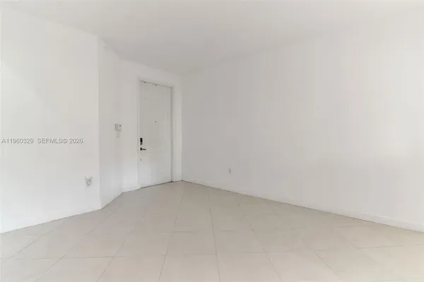 a view of room with window and ceiling fan