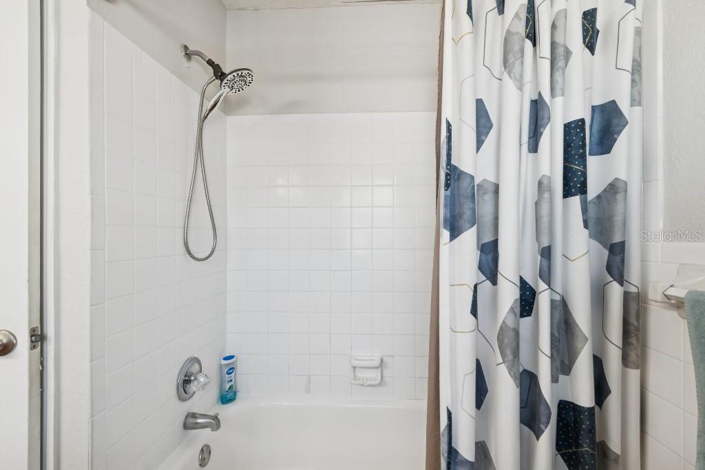 13125 Wilcox Road, Unit 6205 Largo, FL 33774 - Photo 32 of 48 a bathroom with a shower