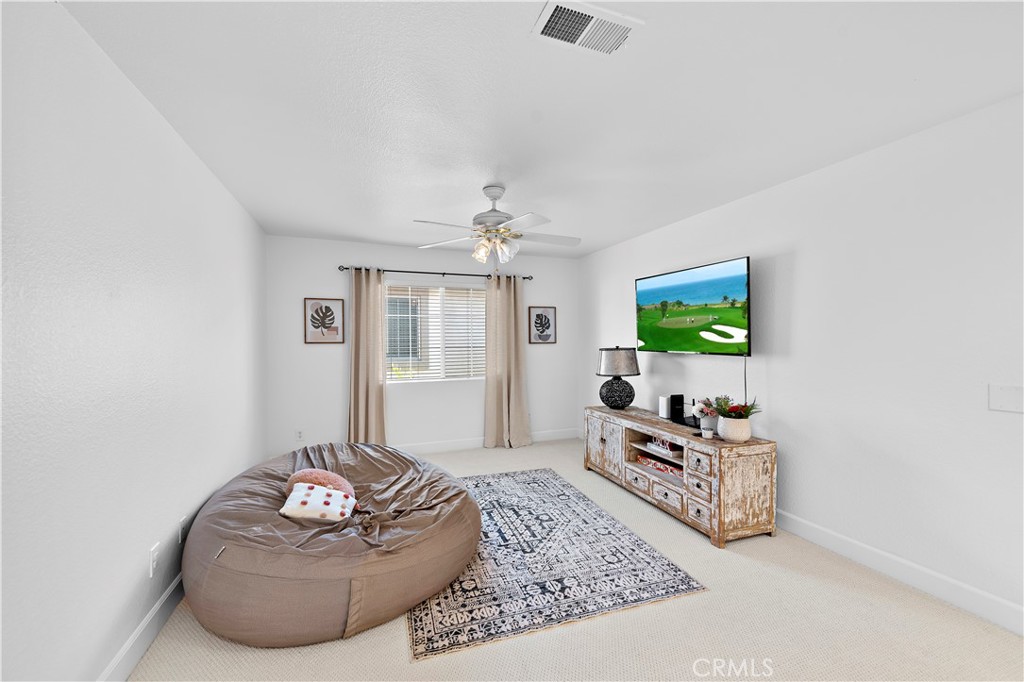 4314 Silver Spring Way Oceanside, CA 92057 - Photo 17 of 47 a living room with furniture and a flat screen tv