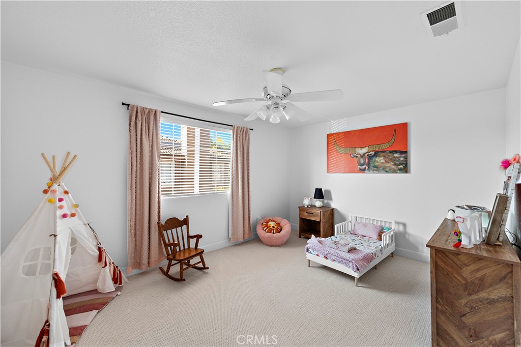 4314 Silver Spring Way Oceanside, CA 92057 - Photo 25 of 47 a living room with furniture and a chandelier