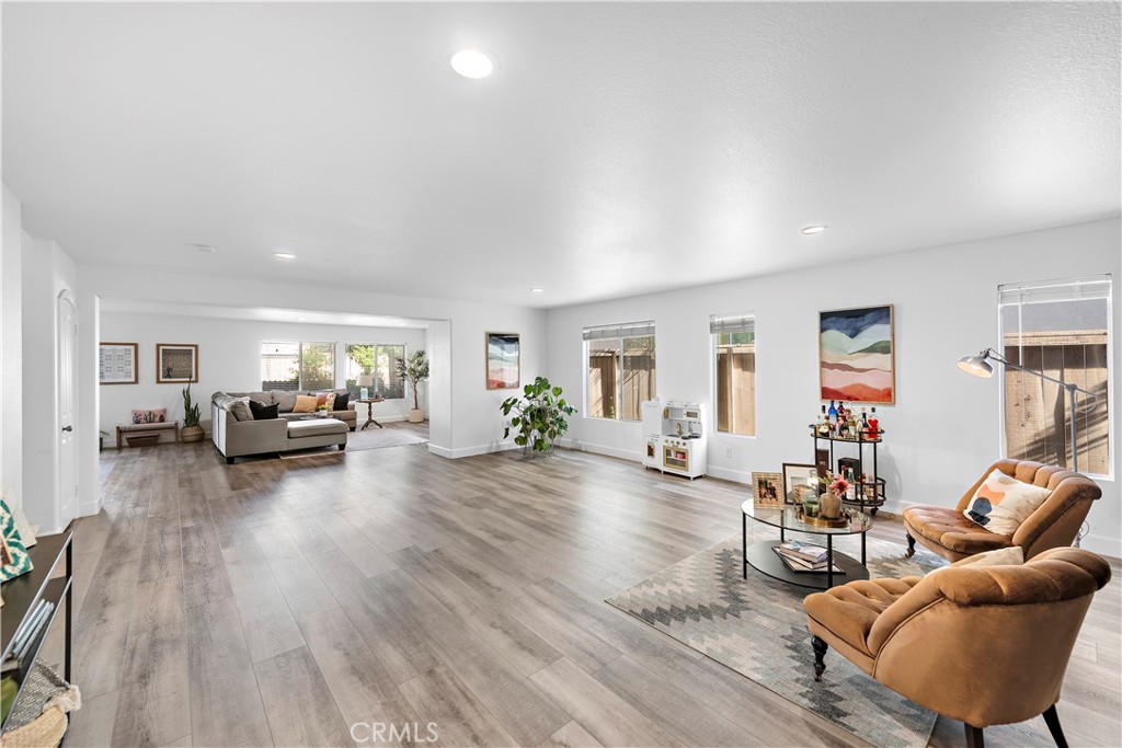 4314 Silver Spring Way Oceanside, CA 92057 - Photo 8 of 47 a living room with furniture and a wooden floor