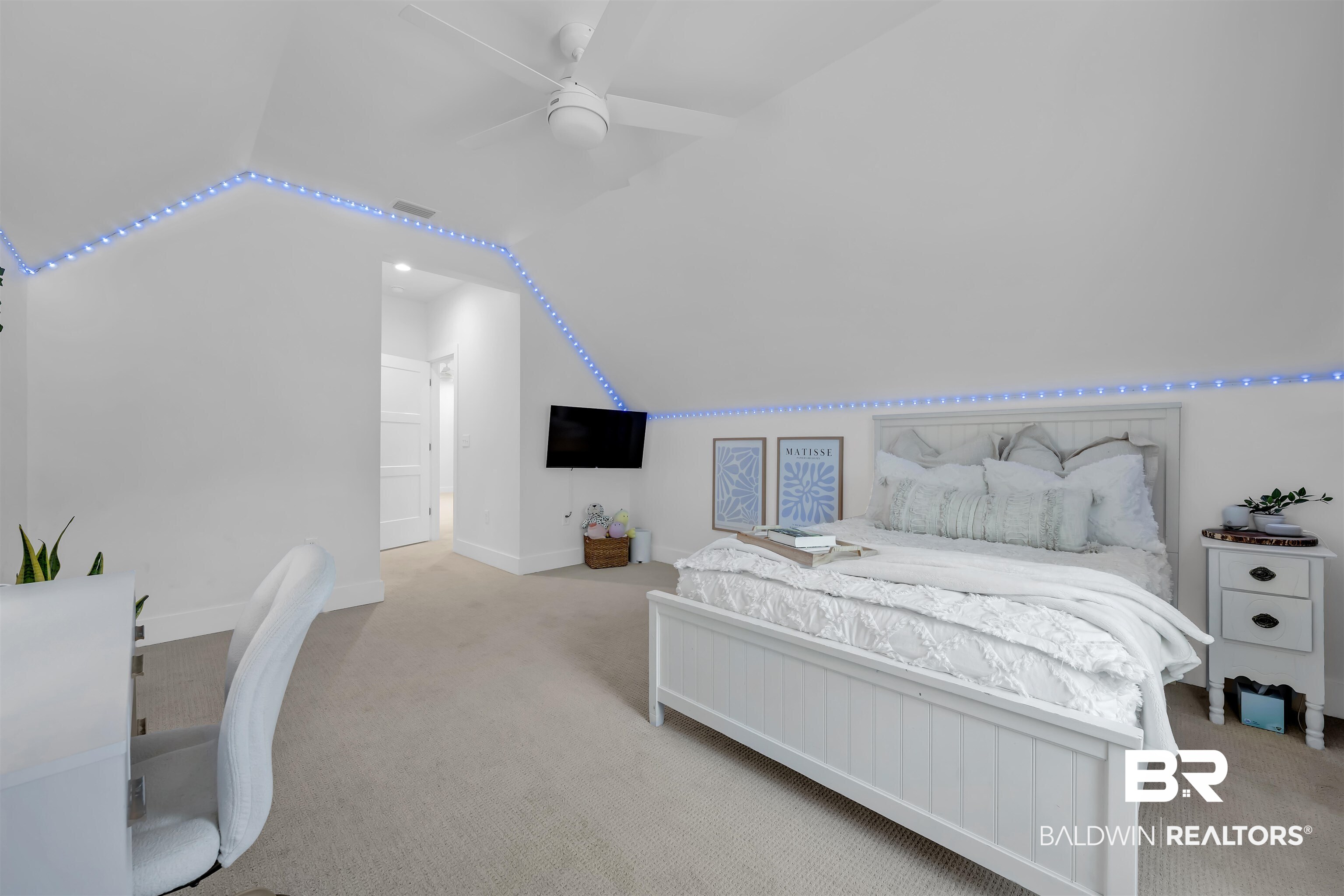 19058 James Road Gulf Shores, AL 36542 - Photo 28 of 49 Bedroom featuring vaulted ceiling, light carpet, a ceiling fan, and an office area