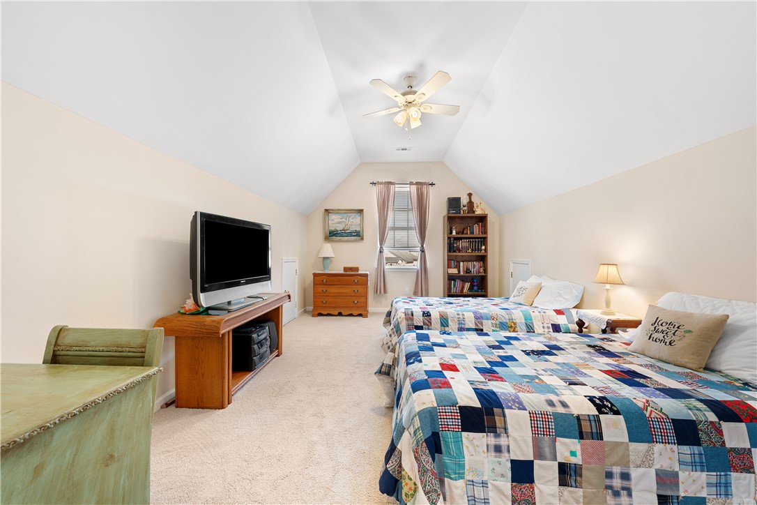 105 Ledgewood Way Easley, SC 29642 - Photo 23 of 35 This bedroom features a unique vaulted ceiling.