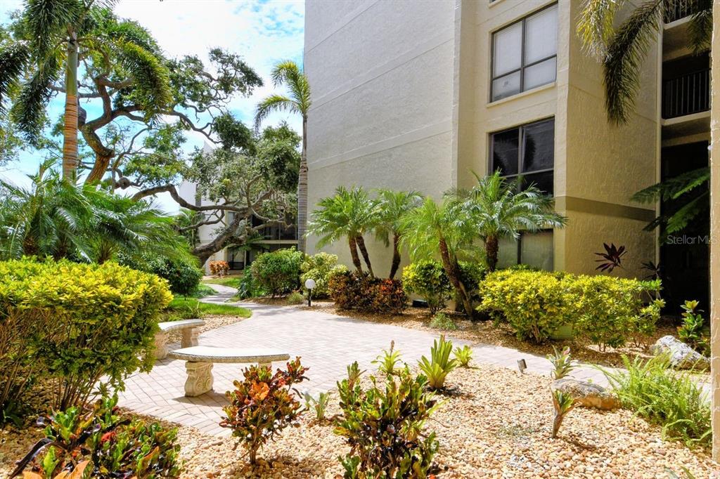 6157 Midnight Pass Road, Unit E63 Sarasota, FL 34242 - Photo 30 of 61 a view of a garden with plants
