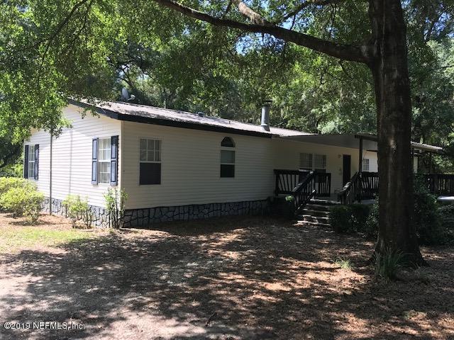 rear of home with large deck