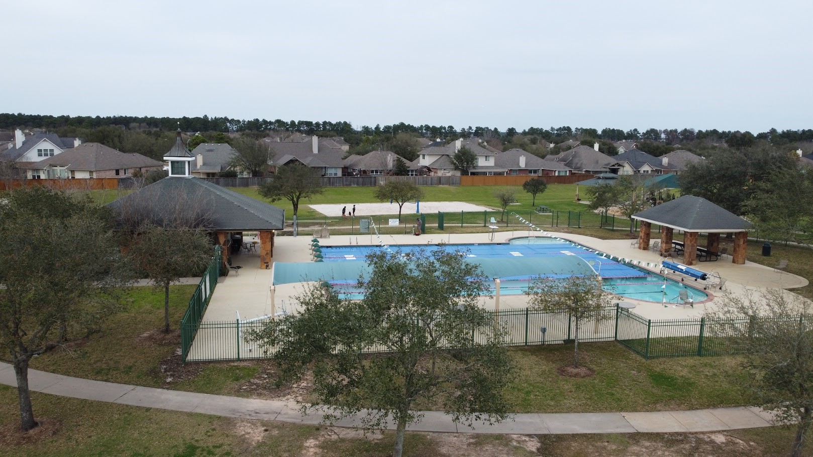 9510 Ashdown Forest Drive Spring, TX 77379 - Photo 49 of 50 COMMUNITY AMENITIES SPORTS COMPLEX– aerial view of the community recreation area featuring pools, green space, and walking paths for residents to enjoy.