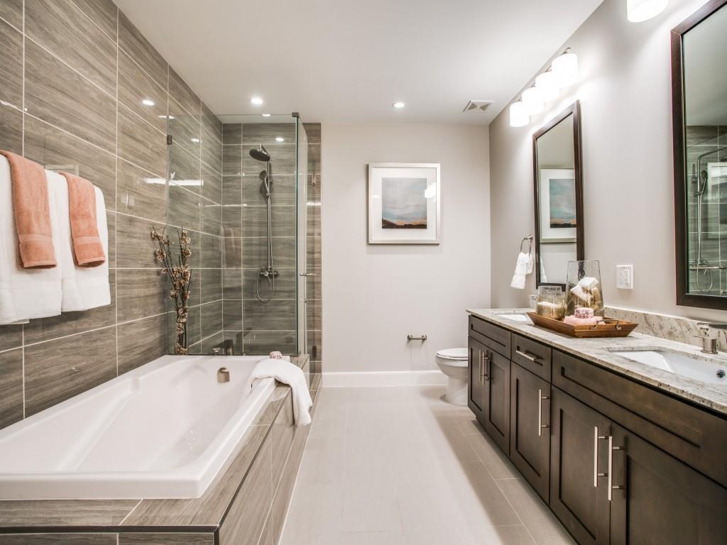 4719 Cole Avenue, Unit 754 Dallas, TX 75205 - Photo 13 of 35 a bathroom with a granite countertop tub a sink and a shower