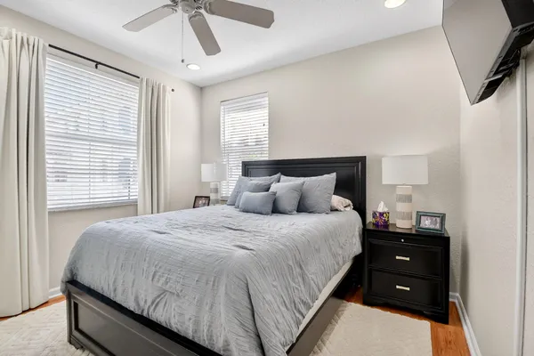 a bedroom with a bed and a tv