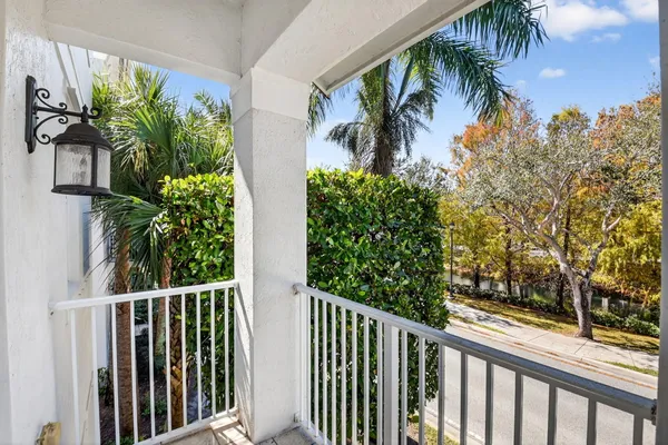 a view of a balcony with a tree