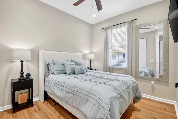 a bedroom with a bed and a window