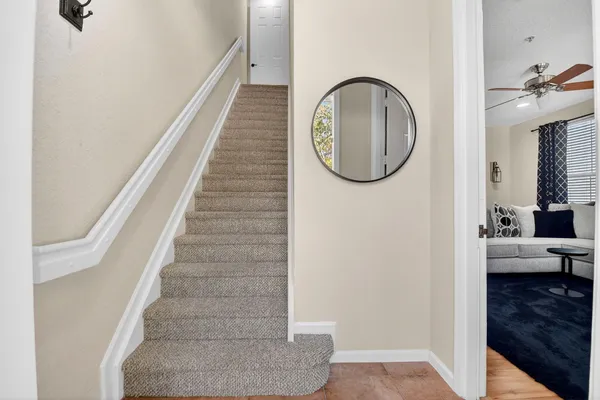 a view of entryway and hall with wooden floor