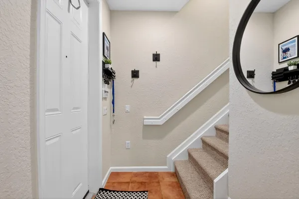 a view of entryway with wooden floor and stairs