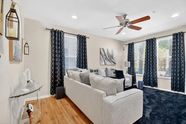 a living room with furniture and a large window