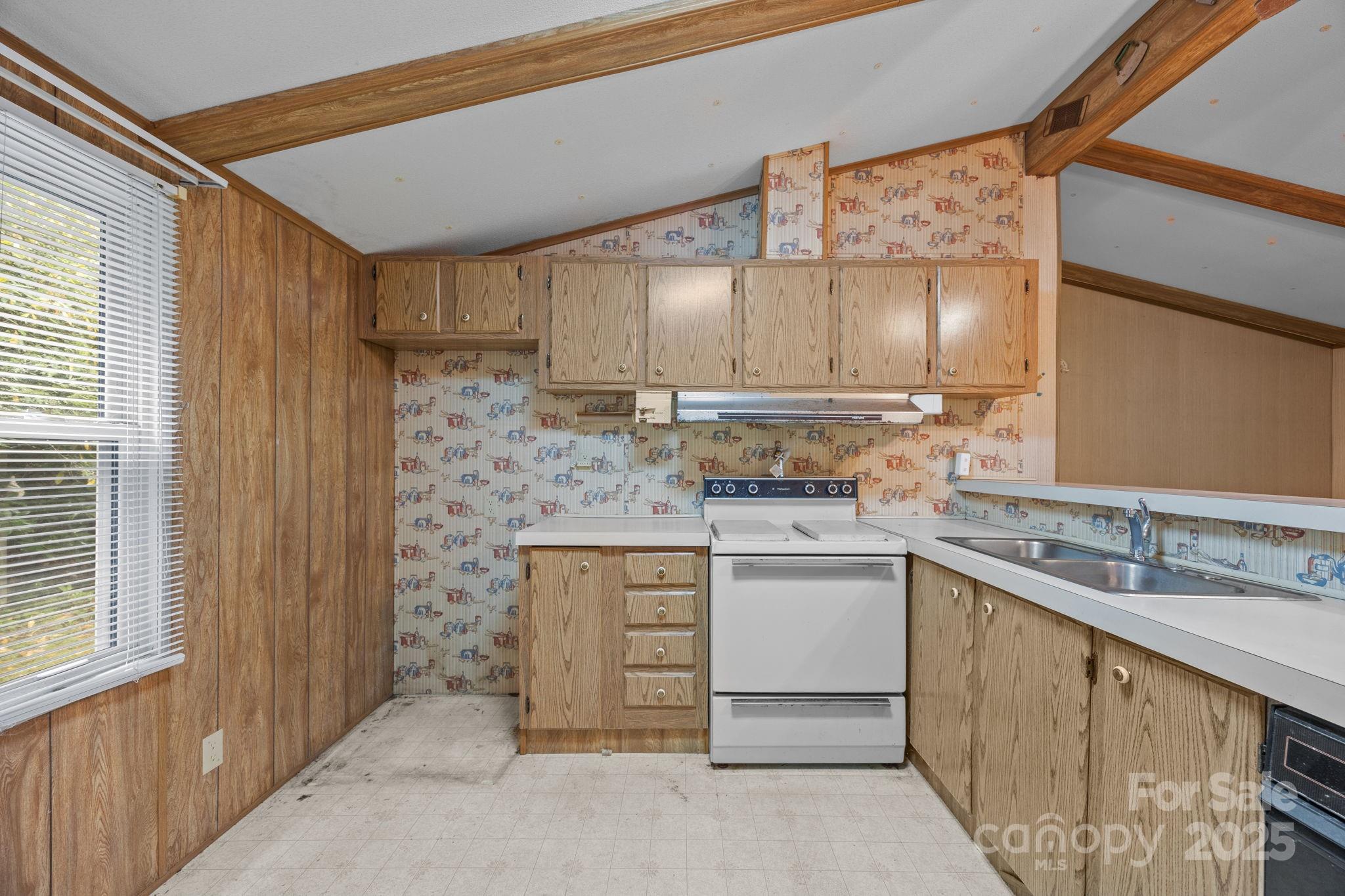 101 Serenity Lane Clyde, NC 28721 - Photo 11 of 26 a kitchen with a sink cabinets and window