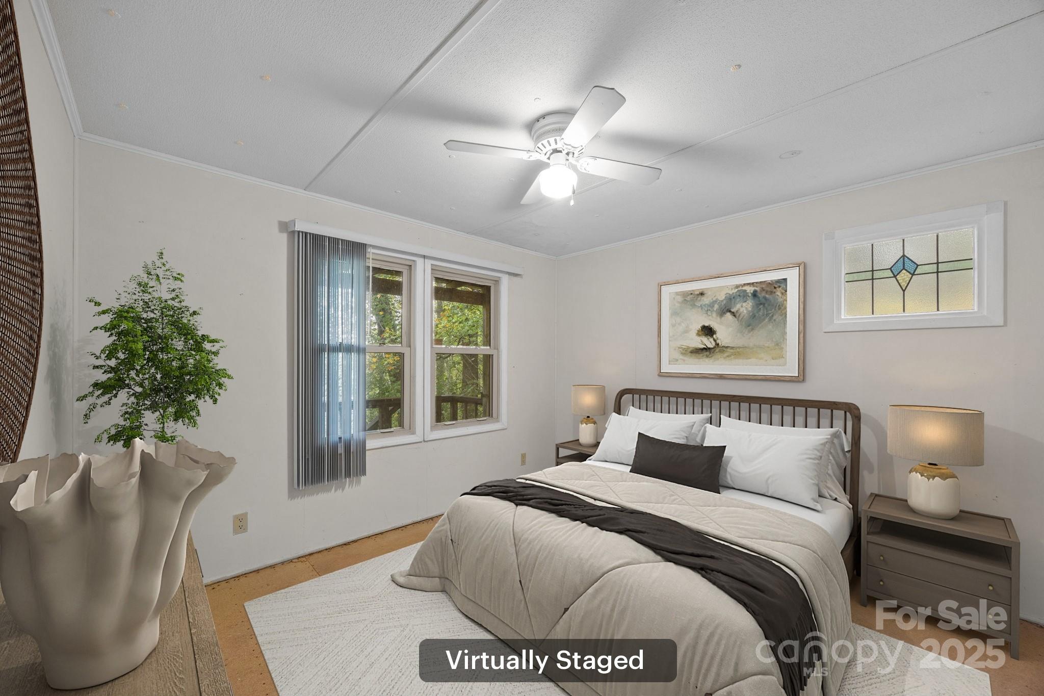 101 Serenity Lane Clyde, NC 28721 - Photo 14 of 26 a bedroom with a large bed and a window