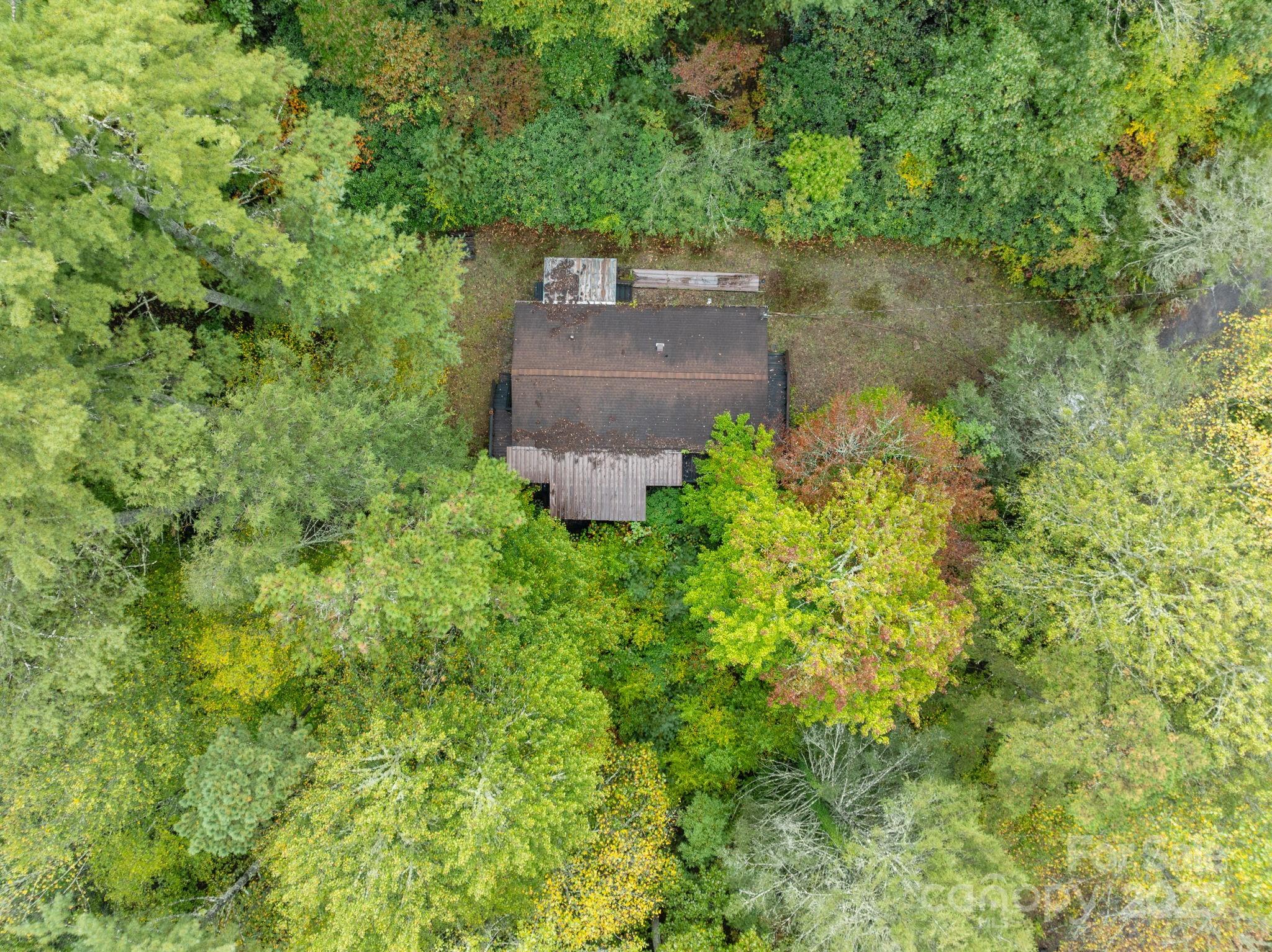 101 Serenity Lane Clyde, NC 28721 - Photo 6 of 26 an aerial view of a house with a yard