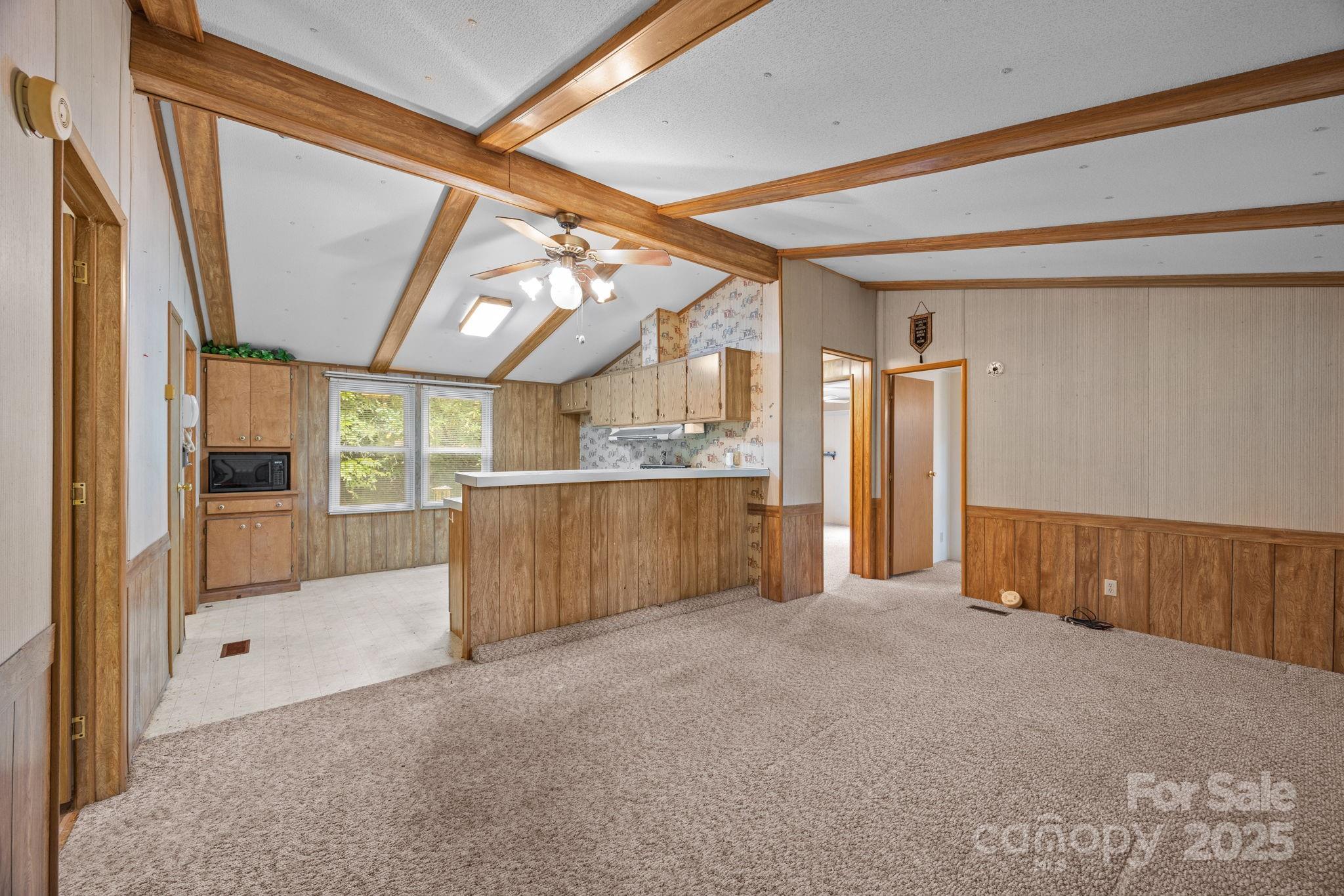 101 Serenity Lane Clyde, NC 28721 - Photo 7 of 26 a view of a hallway with wooden shelves