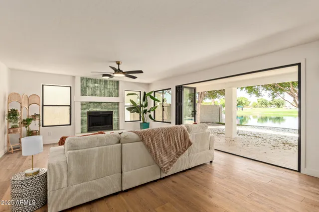 a kitchen with a stove a sink a dining table and chairs