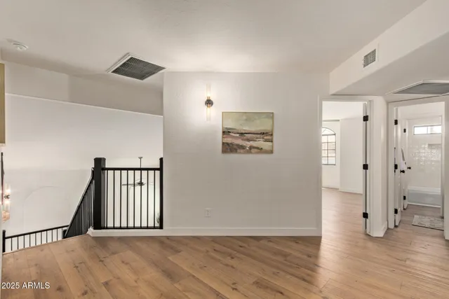 a area with wooden floor and window