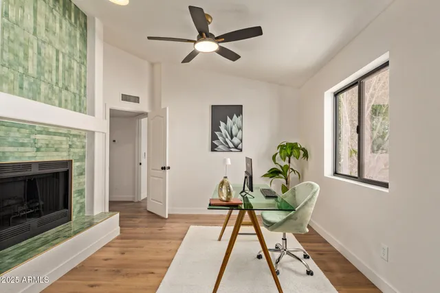 a living room with furniture and a fireplace