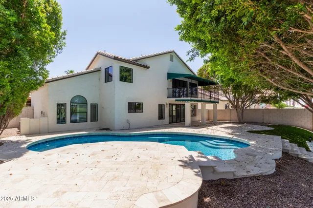 a view of a tree in front of a yard