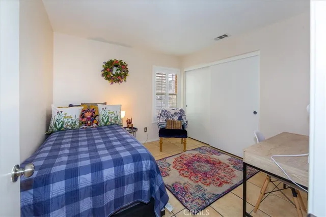 a bedroom with a bed and a table in it