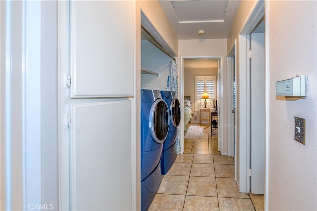 2374 Nash Lane Oxnard, CA 93033 - Photo 14 of 18 a hallway with a washer and dryer