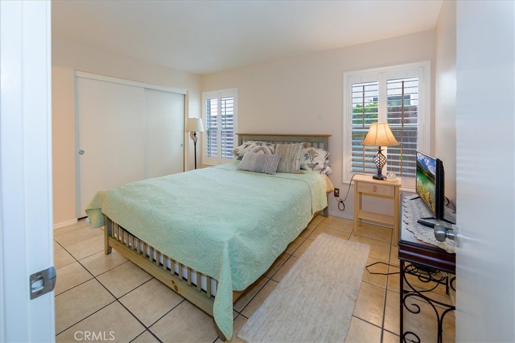 2374 Nash Lane Oxnard, CA 93033 - Photo 8 of 18 a bedroom with a bed and a window in it